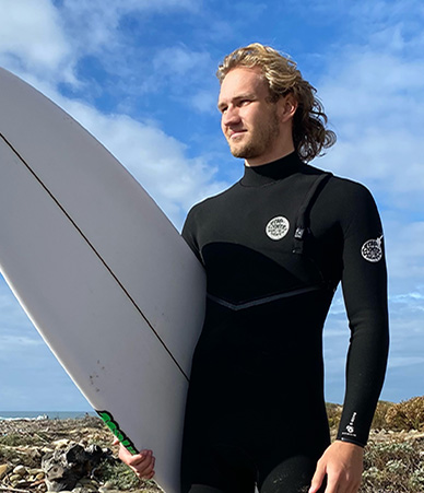 Colin with surfboard